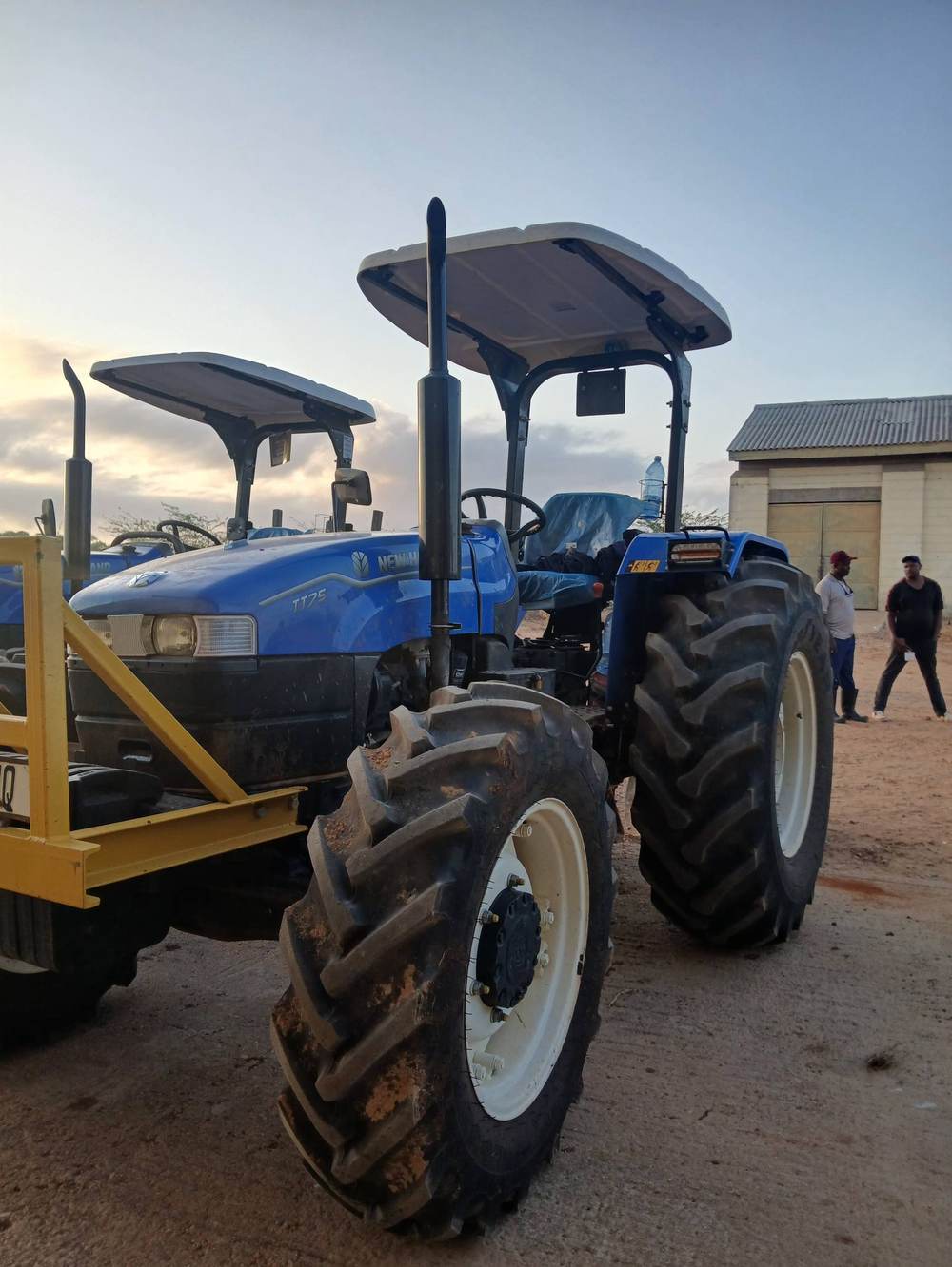 Close-up of a New Holland TT75 tractor at dusk.